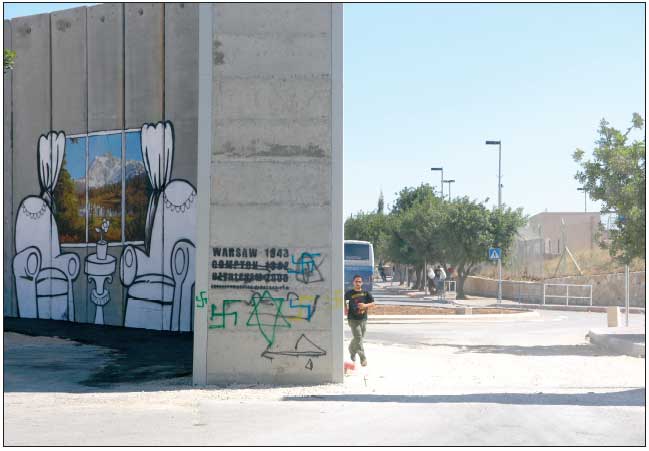 Muro en Belén con el grafiti de Bansky